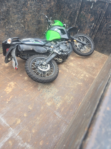 Two motorcycles parked next to each other on the ground