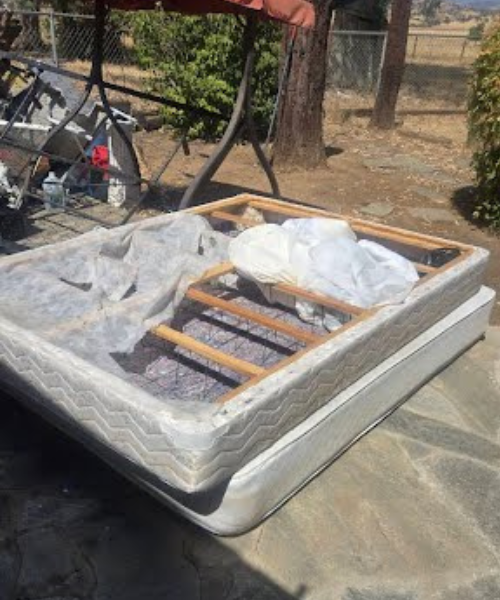 A mattress sitting on top of a stone slab