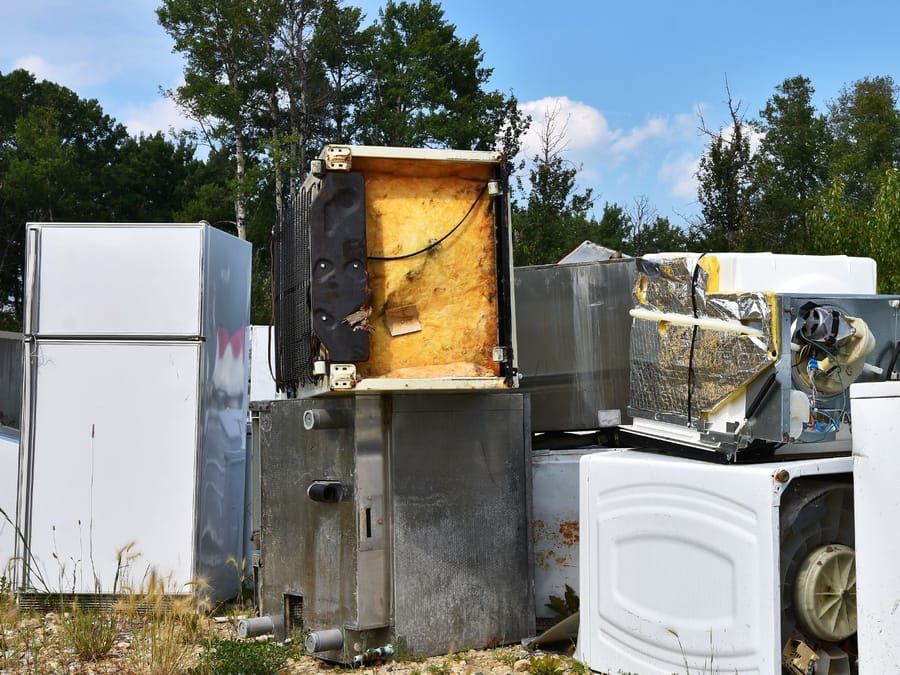 Old washer, dryer, stove and refrigerator awaiting proper disposal in Fresno, California