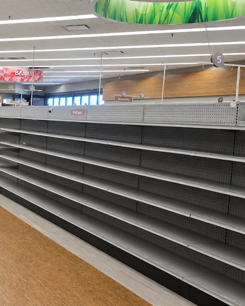 Emptied Fresno retail store interior with bare shelving after a commercial cleanout