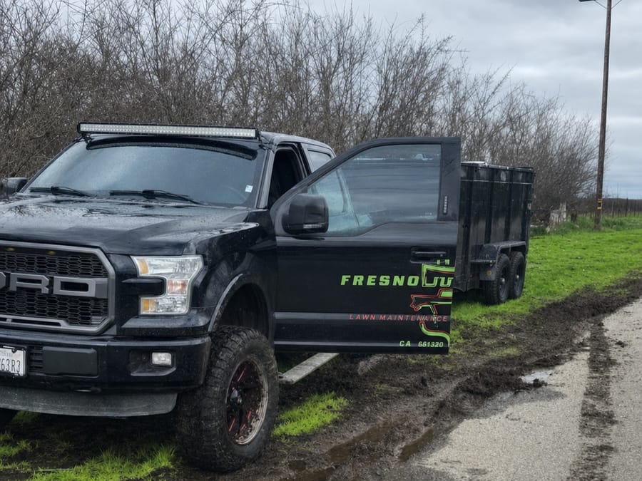 Fresno Junk Haulers truck and trailer on the road heading to a Visalia, CA collection