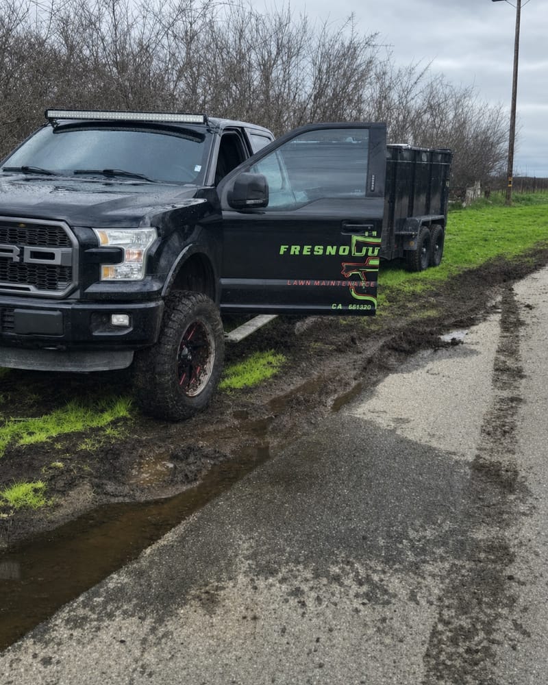 Fresno Junk Haulers truck and dump trailer on the road heading to a same-day collection